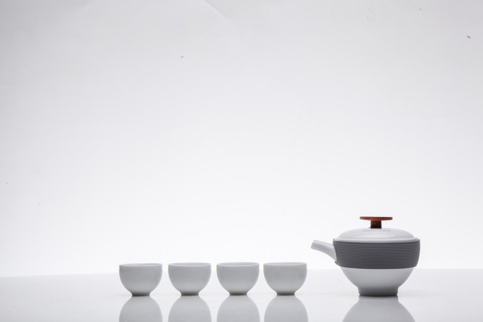 Jingdezhen tea set with teapot and four cups bright white background